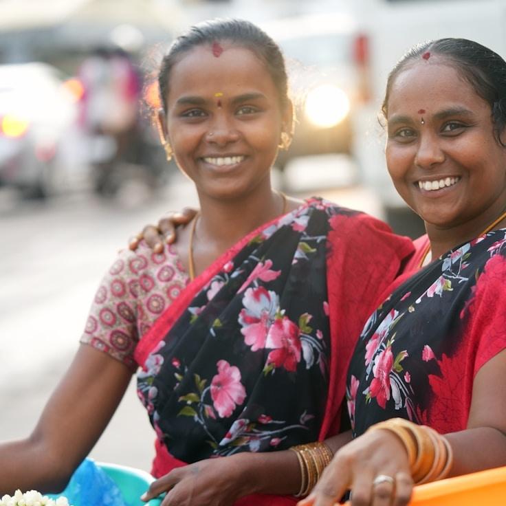 Kaveri Mehta, Lead Design Curator at Glade Friendly Unity, reviewing corporate floral arrangements